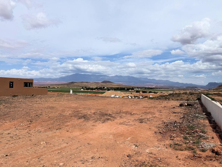 Large lot with spectacular views in Rock View Subdivision.  Bring your own builder. Horse friendly and views galore. Located in the Hurricane Fields area and close to Copper Rock golf course, enjoy similar views for a fraction of the price. No HOA and endless opportunities.  This lot won't last.