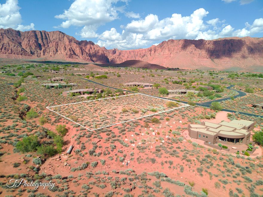 Ready to build? Treat yourself to this 1.37 acre view lot in Kayenta. This lot may be sold with the home to the north (1215), for a total of 2.38 acres. The lot backs onto the Cactus Gulch Wash creating an even greater sense of space and privacy. Embrace the best of life against the stunning backdrop of Kayenta's inspiring red rock cliffs with glowing sunsets and 300' waterfalls after a desert downpour. Get your culture on with the Kayenta Art Village galleries, the Center For The Arts, Xetava Cafe & Rusted Cactus bar/grill. Satisfy your need for adventure with unrivaled access to southern Utah's renowned recreational opportunities: Snow Canyon, Gunlock State Park & reservoir, Dixie National Forest & Pine Valley alpine recreation area just to name a few nearby favorites. Whether you're stargazing under the protected night sky or enjoying the "blue view" of Utah's West Mountain, Arizona's Beaver Dam Wash National Conservation Area, the nearby Joshua Tree National Natural Landmark, and countless other wonders await your discovery.

* Owners are members of the Kayenta Recreation Association (KRA). KRA administers two pools, as well as tennis courts.