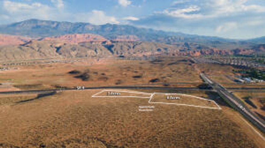 This is an incredible opportunity to own up to 9.26 acres (adjacent 6.26 acres for sale also) right at the junction of SR7 and SR9 right at the corner of the interchange! These parcels sit right in the path that millions of visitors use to visit Zion National Park and all of the surrounding recreational activities in the area. Massive development is already underway in this popular vacation spot, including the new Jellystone Park™ Zion, UT.  Jellystone is a brand new water park and campground located on Sand Hollow Rd on the way to Sand Hollow Reservoir.

Sand Hollow State Park is also just minutes up the road and is an adventure oasis featuring a 1,322-acre reservoir and an extensive off -highway vehicle recreation area on Sand Mountain. Hugely popular with outdoor enthusiasts, Sand Hollow draws thousands of visitors each year.  

Walmart is towards the west and in close proximity to the parcels. Downtown Hurricane with plenty of restaurants and shopping is just to the east. These parcels are in a prime location where much development is in the works. 

This gateway area is the up-and-coming new Southern Utah destination area that will be a major economic hub for Hurricane and the surrounding area.
The proximity of the airport (which can be accessed on SR7), St. George, Mesquite, Las Vegas, SLC etc. make this a prime investment opportunity.  
Construction has begun on the new frontage road that will service this parcel. The roundabout off Sand Hollow Rd. (3700W) has been started and the road is heading east and this phase will end at this parcel. See new pics! 
Hwy Commercial zoning allows for Hotels, RV Parks, restaurants,  and many other tourist related opportunities. The utilities and frontage road improvements which will service these parcels have received city approvals and are in the works through the Gateway PID.