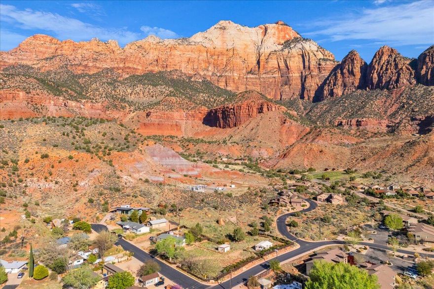 Build your dream retreat in the heart of Zion Canyon! 

Rare and unique opportunity to own 3 contiguous homesites in the heart of downtown Springdale with exceptional 360 degree views. 

No HOA and features .62 acres total, also including a charming 513 sq ft home. 

The views are amazing but the location is top notch as well with convenient walking or biking access to all of the wonderful downtown restaurants, shops, and outfitters.

Property is offered as-is. Additional parcel numbers are S-W-1-A-9-A and S-160-A-3 and these also include already installed city water connections and meters. 

Zoning is Valley Residential A, long term rentals and duplexes are permitted subject to town code and city approvals. 

Short Term Rentals are prohibited.