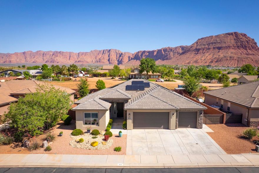 Seriously, this home has it all, including a full array of solar panels and swim spa! PLUS it's MOVE-IN READY! LOW, LOW utilities, beautiful finishes, terrific neighborhood, GREAT views of the spectacular Red Mountain, NO HOA, and ALL ON ONE FLOOR! This lightly-lived-in, lovingly cared-for home is longing for new owners. 4 bedrooms, 3 baths, w/ upgraded appliances and fine fixtures throughout. Secluded yard also features a covered patio, waterfall fountain and two fire pits. PLUS there's RV parking AND a fantastic 3-Car Garage with built-in cabinets and shelves and plenty of additional storage. A perfect workshop! Come check it out and enjoy Southern Utah at its best! Solar panels. Whole-house water filtration system. Patio plumbed with natural gas. Fully-fenced.