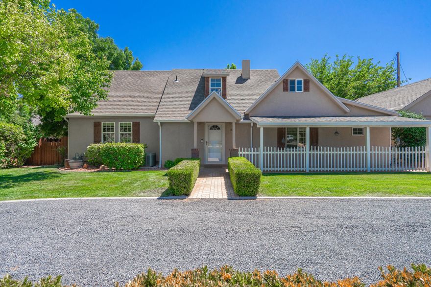 Welcome to a quaint home in the heart of Hurricane which exudes character with a blend of warmth, personality and charm, inside and out. The backyard is a quiet, serene setting, which feels like your own private sanctuary—lush, peaceful, and perfect for relaxing or entertaining. Enjoy beautiful mountain views and the freedom of NO HOA restrictions. The spacious garage includes a large attached workshop, ideal for hobbies, projects, or extra storage. This is a one-of-a-kind property that offers both comfort and functionality in a truly tranquil setting. NOTE: Although the home was originally built in 1938, in 2005 it was taken down to the foundation and completely rebuilt.