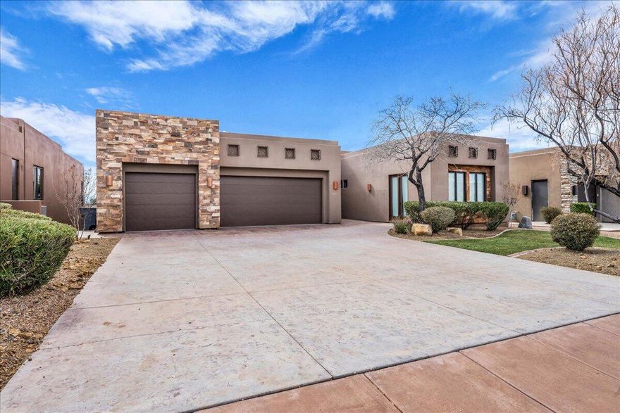 Experience elevated living in The Ledges! Tucked within a serene, sought-after neighborhood, this beautifully renovated home sits directly on The Ledges Golf Course, showcasing stunning views of the fairways and Snow Canyon's striking red rock cliffs. Designed for seamless indoor-outdoor living, the home features expansive patios, lush landscaping, and a built-in hot tub--perfect for both entertaining and unwinding. Inside, the bright, open-concept layout offers soaring ceilings, fresh paint and carpet, and elegant upgrades throughout, including granite countertops and premium Wolf & Sub-Zero appliances. The main-level primary suite provides a private, comfortable retreat, while the separate casita is ideal for guests. A spacious 3-car garage, abundant storage, and a downstairs family room with a kitchenette ensure plenty of room for everyone. Recent updates such as a new roof and water heater add extra peace of mind. With low HOA fees, impressive curb appeal, and convenient access to Fish Rock Grille and other community amenities, this home offers the perfect blend of luxury, comfort, and Southern Utah's natural beauty. Don't miss this rare opportunity to own a golf-course sanctuary that truly stands out at The Ledges! Buyer/buyer agent is responsible for verifying all information. family room with a kitchenette ensure plenty of room for everyone. Recent updates such as a new roof and water heater add extra peace of mind. With low HOA fees, impressive curb appeal, and convenient access to Fish Rock Grille and other community amenities, this home offers the perfect blend of luxury, comfort, and Southern Utah's natural beauty. Don't miss this rare opportunity to own a golf-course sanctuary that truly stands out at The Ledges! Buyer/buyer agent is responsible for verifying all information.