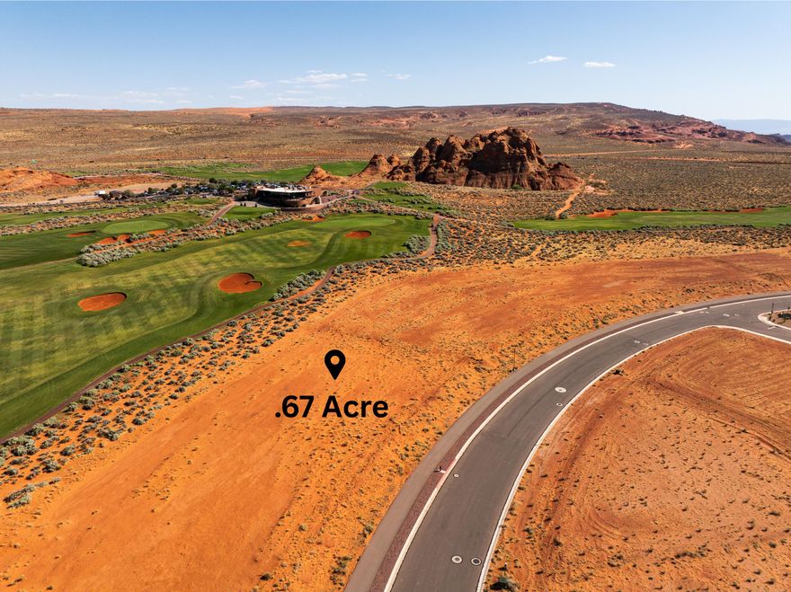 Pad ready .67 acre lot located on the 18th hole of the Sand Hollow Golf Course with incredible views and an unbeatable lifestyle opportunity. This homesite offers the ideal blend of luxury desert living, scenery, and access to some of Southern Utah's best outdoor recreation.
Located just over 1.5 miles from Sand Hollow State Park, the property offers quick access to boating, paddle boarding, cliff jumping, dune riding, beach days, and endless desert trails.
HOA amenities include access to three pools, two hot tubs, a fitness center, and two pickleball courts. Residents also enjoy live music events and annual community celebrations such as the Car Show, Sky Fest Hot Air Balloon Festival, and Pioneer Day festivities. The Grille at Sand Hollow provides dining overlooking the golf course, while homeowners enjoy discounts at the Pro Shop, dining, and community events, along with 40% off Championship Course Golf and 10% off Mad Moose UTV and watercraft rentals.
Individuals or builders may purchase lots within the community. Builders are required to go through the approval process in order to build within the Estates at Sand Hollow. A minimum of 3,500 square feet of livable space is required, with architectural guidelines and design standards in place to preserve the elevated feel and cohesive look of the community, including approved color palettes and height parameters.
Boundaries drawn are approximate and deemed reliable but not guaranteed. Buyer(s) to verify all.