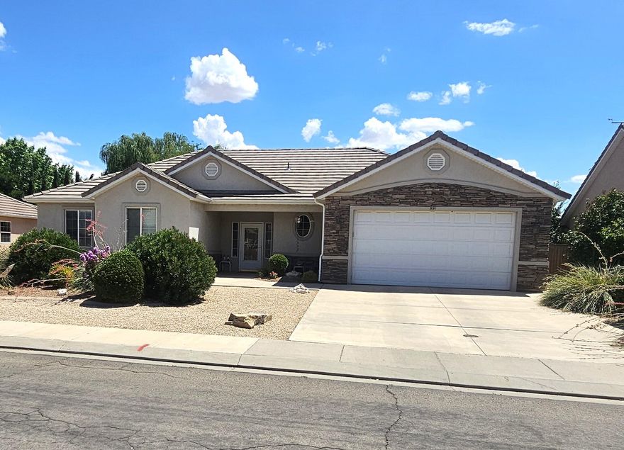 Immaculate home with full desert landscape. Home features large pantry, expanded garage with shop area, concrete apron surrounding home, added radiant barrier and insulation, Sun Shields on west and south windows, storm door, garden area and yard features and secondary water system for irrigation.