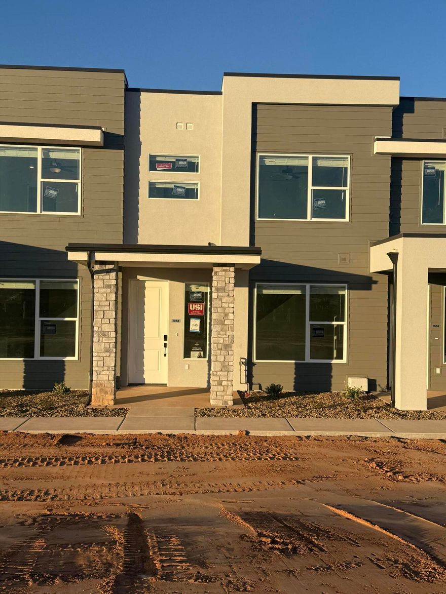 This inviting 3 bedroom, 2.5 bathroom townhome boasts a prime location just moments away from Zion Shores surf park, Warner Valley, and Sand Hollow making it perfect for outdoor enthusiasts and adventure seekers. The spacious living area flows seamlessly into a well-appointed kitchen complete with stainless steel appliances. The generous primary bedroom is complete with an en-suite and walk in closet. Two additional bedrooms provide plenty of space for guests, a home office, or hobbies and they share a stylishly designed full bathroom. A convenient half-bath is located on the main level. Step outside to enjoy your own covered patio where you can enjoy views of Warner Valley and Pine Valley.