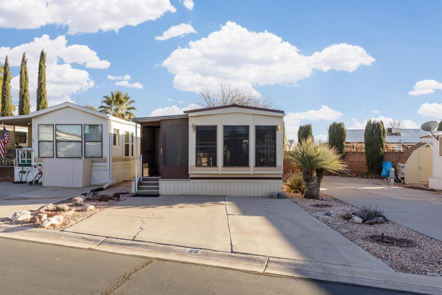 Dixie Downs is the ultimate 55+ community!  This park model is lovingly kept up.  The addition of the den/bedroom and laundry room makes it very spacious.  A simple install of a door would make this a two bedroom unit. Roof is only 3 years old and the power pedestal is 4 years old. This unit includes solar shades to keep it cool.  Washer, dryer and refrigerator are all included.  There is an ample storage shed that is wired with power and light in the back.  The low HOA fee of $85 p/m give you access to pool, hot tub, clubhouse and more.  The community is very active with many activities throughout the year.  A perfect place to spend your retirement years!