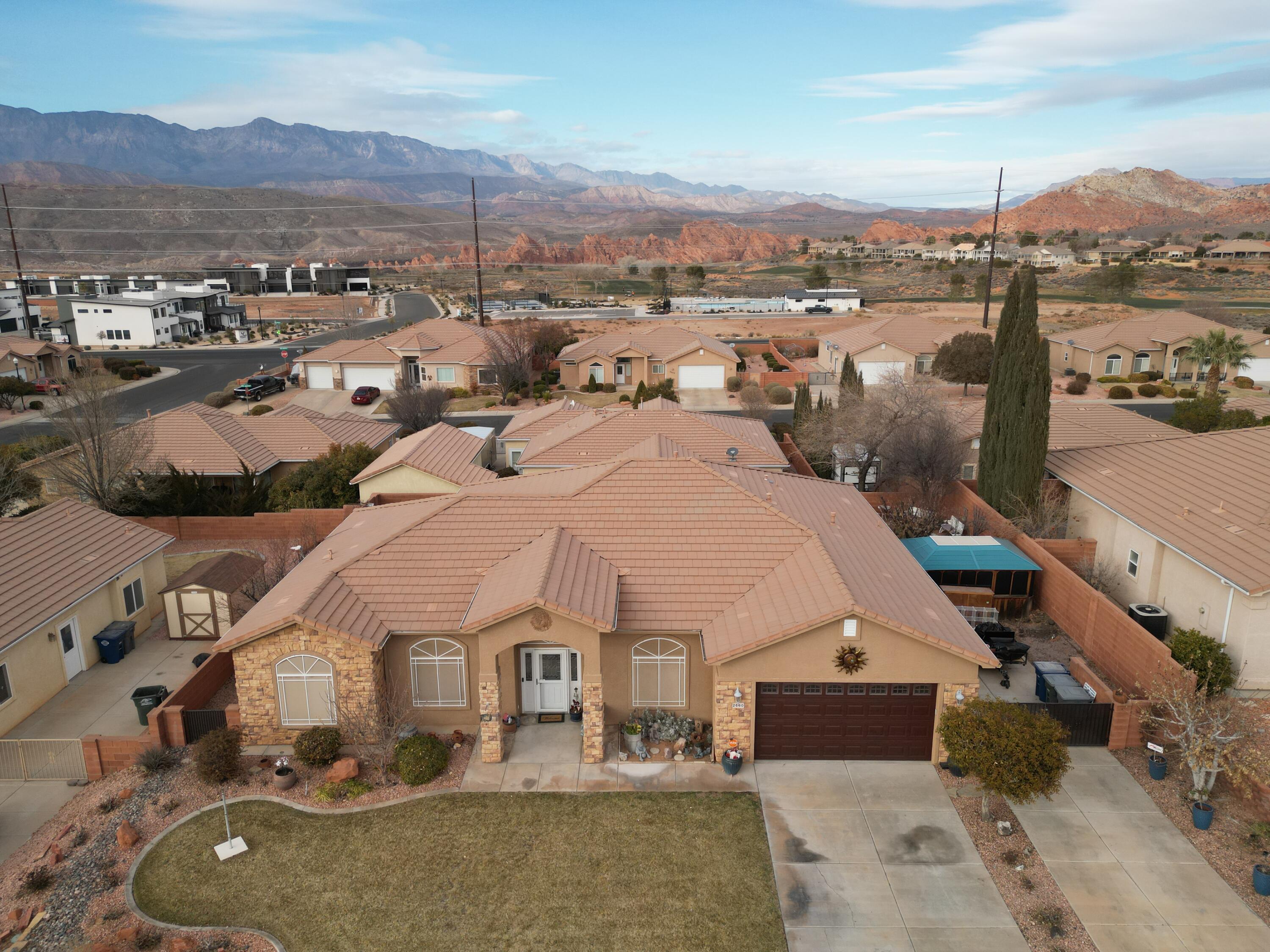 Discover comfort and convenience in this beautifully maintained 4-bedroom, 2-bathroom home in the heart of Hurricane, Utah! Spanning 2,165 sq. ft., this home features a spacious, open-concept family room and kitchen, perfect for entertaining. Cozy up by the fireplace or relax in the large covered sunroom that offers year-round enjoyment. The fully fenced and landscaped yard provides privacy, while RV parking and a spacious 2-car garage with extra storage ensure plenty of room for all your needs. Ideally located just minutes from Sky Mountain Golf Club, and a short drive to Sand Hollow Reservoir and Zion National Park, this home is perfect for those who love the outdoors. Don't miss this incredible opportunity to live in one of Southern Utah's most desirable locations!