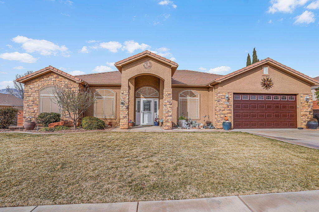 Discover comfort and convenience in this beautifully maintained 4-bedroom, 2-bathroom home in the heart of Hurricane, Utah! Spanning 2,165 sq. ft., this home features a spacious, open-concept family room and kitchen, perfect for entertaining. Cozy up by the fireplace or relax in the large covered sunroom that offers year-round enjoyment. The fully fenced and landscaped yard provides privacy, while RV parking and a spacious 2-car garage with extra storage ensure plenty of room for all your needs. Ideally located just minutes from Sky Mountain Golf Club, and a short drive to Sand Hollow Reservoir and Zion National Park, this home is perfect for those who love the outdoors. Don't miss this incredible opportunity to live in one of Southern Utah's most desirable locations!