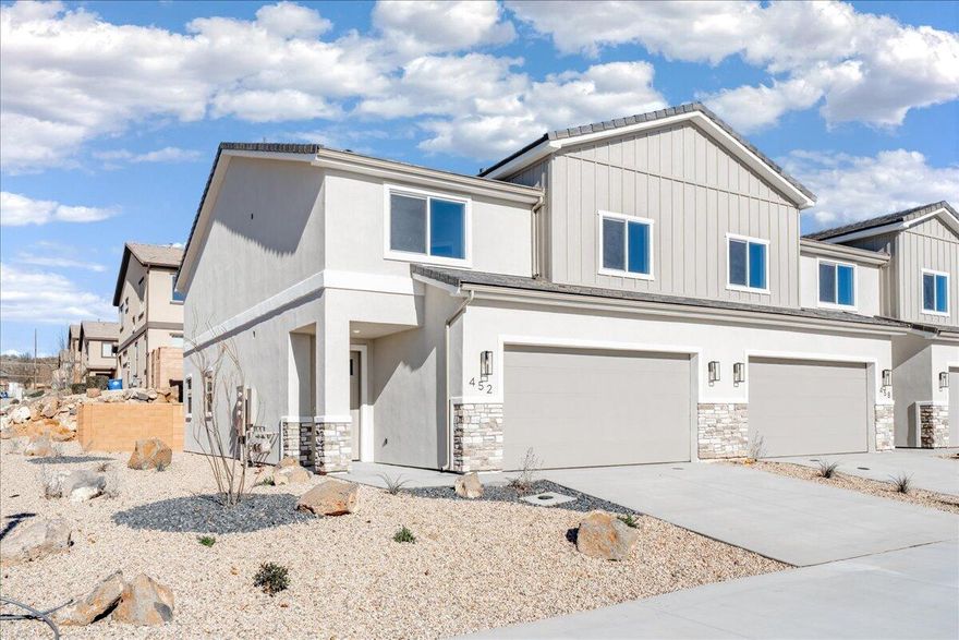 Welcome to this brand-new 4-bedroom, 2.5-bath townhome in the heart of Hurricane, Utah, offering 2,346 sq ft of beautifully designed living space. Thoughtfully upgraded throughout, this home features granite countertops, engineered wood flooring, and tile showers and baths that bring both style and durability together. The open-concept layout is perfect for entertaining or everyday living, while the large bedrooms provide comfort and flexibility for family, guests, or a home office. Enjoy the convenience of a full-size 2-car garage and low-maintenance living with HOA dues of just $100 per month. Ideally located near outdoor adventure, you're just minutes from world-class hiking, biking, and sightseeing at Zion National Park, with easy access to local shopping, dining, and schools. Whether you're looking for a primary residence, second home, or investment property, this move-in-ready townhome delivers modern finishes, generous space, and an unbeatable Southern Utah lifestyle.