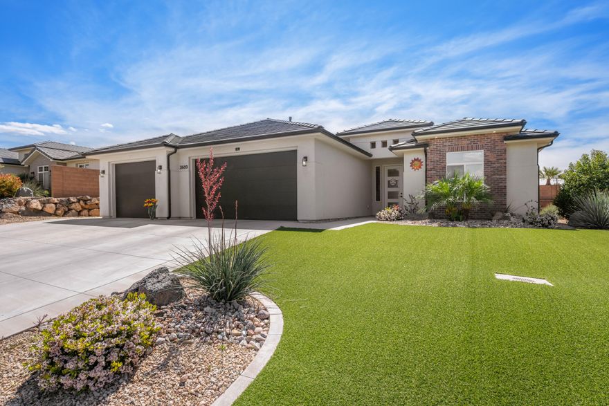 Turnkey and beautifully designed, this 2021-built Hurricane home with 3 car garage offers the perfect blend of comfort and style. Featuring a bright open floor plan with high ceilings, the space feels both inviting and expansive. Every bedroom is oversized--each accommodating California king beds--providing plenty of room for everyone to spread out. The kitchen and living areas flow seamlessly together with an open floor plan and are finished with modern touches like soft-close drawers and window tint for added efficiency and privacy. This home has been meticulously cared for, with annual servicing on the HVAC system since new. New water softener and stove.  Outside, enjoy a fully zero-scaped yard with turf for easy, low-maintenance living. To make things even better, all TVs, artwork, and furniture can be included--making this a truly move-in ready opportunity from day one.