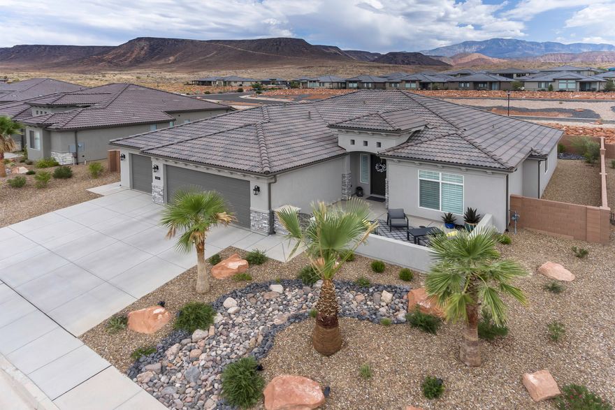 This STUNNING HOME shows like a MODEL HOME and Built in 2020 Home includes the GREAT ROOM concept with a split floor plan. The modern style KITCHEN has large ISLAND w/ GRANITE countertops, Upgraded Stainless Appliances, Cabinet Lighting & Walk-in pantry. ALL NEUTRAL paint throughout, GORGEOUS WOOD PLANK TILE FLOORS in all high traffic areas, vibrant FIREPLACE, & Wood PLANTATION Shutter

The Primary Owner Suite comes w/ HUGE WALK-IN CLOSET, WALK-IN shower, DUAL SINKS, and QUARTZ countertops. The BACKYARD is perfectly landscaped & faces north for BREATH-TAKING VIEWS of the RED ROCK Preserve & the Pine Valley Mtns. Close to Red Rock Preserve, National Parks like Zion, Shopping, Hiking & Biking Trails. HOA covers common areas.