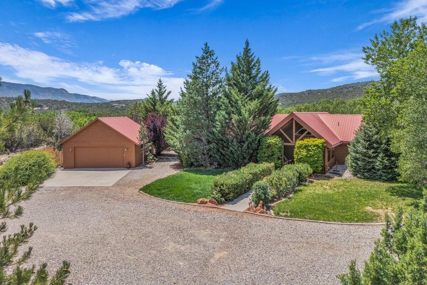 Dreaming of your own mountain retreat in New Harmony, UT?🌲 

This 5 bed, 3.5 bath log home sits on 5.19 acres with stunning mountain views, privacy, & space for everyone—including an ADU with its own entrance & bath! 

Inside features vaulted ceilings, a stone fireplace, large windows, & a chef's kitchen with double ovens for entertaining guests.

Relax on the large deck or covered patio & enjoy the RV hookups on site. The walkout basement is an absolute fun zone with a rec room, family room, & tall ceilings.  

Detached, oversized 3-car garage offers space for toys or tools.

The home backs to Ash Creek Reservoir & state lands. Just 20 min to Cedar City, 25 to St. George, & 45 to Zion. This is your chance to own a slice of Utah's great outdoors!

Home is owner/agent.