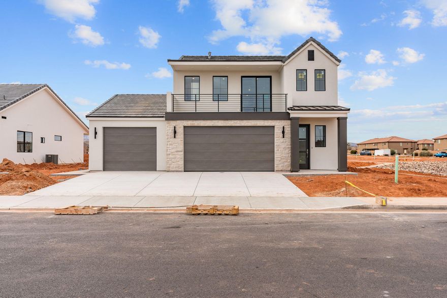 Introducing the Lupine floor plan in beautiful Santa Clara, UT — a thoughtfully designed 3-bedroom, 2-bath home offering 2,050 sq ft. Enjoy transparent pricing with designer finishes included and stunning mountain views from the front deck. The flexible layout features an upper-level loft and quality upgrades throughout, including 42'' cabinets with laundry cabinetry, a gourmet kitchen with upgraded appliances and microwave, tile showers, upgraded carpet and hardwood flooring, custom closet shelving, walk-in closets, upgraded lighting, extra garage storage, and a concrete rear patio extension. Fully finished landscaping with rear and side block walls. Located near Black Desert Resort, Harmons, and Gubler Park.