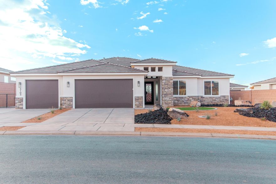 Soon to be built by Gemstone Custom Homes! Come in soon if you want to personalize this home with customizations. We have a tremendously successful layout here with an extra deep backyard looking east at the high plateaus of Zion National Park. The listed price includes many upscale features like a finished backyard with automatic drip irrigation, gated RV parking slab with full hookups (50-amp electric, sewer dump, water), full perimeter block wall, heavy iron front door for both security and wow factor, tile floors throughout the main living areas and bath and laundry rooms, Solid hardwood cabinet doors with boxes made of 9-ply birch, large covered back patio, stand alone tub in the owner's bathroom, all ceilings 9' or higher, over the stove ventilation hood, built-in wall oven and microwave, electric fireplace provides ambiance (heat optional), fully tiled master shower with a recessed floor, tankless water heater with recirculating pump, and views you'll need to see in person!
Photos are of similar, previously built homes. Finishes will vary. Contact us for more info.