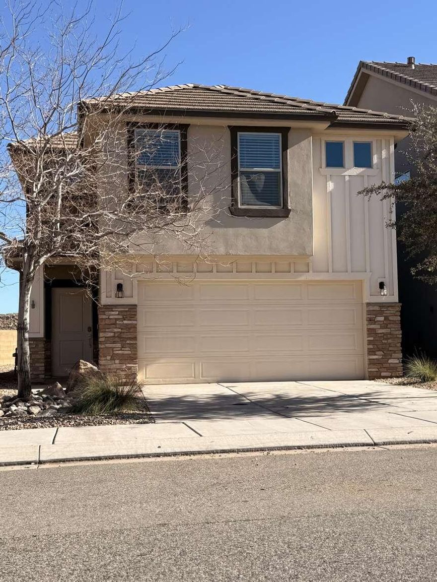Welcome to this charming, low-maintenance 4-bedroom, 2.5-bath townhome in the highly sought-after Desert Bluff at Desert Canyons community! Built in 2018, this 1,664 sq ft, 2-story home offers modern living with an open-concept layout, granite countertops, stainless steel appliances, and abundant natural light. The spacious master suite includes a private bath, while the additional bedrooms provide flexibility for bedrooms, guests, or an office. Enjoy the attached 2-car garage, small fenced patio for outdoor enjoyment, central air conditioning, and low HOA fees. Located in southern St. George with quick access to shopping, dining, schools, and major route.
