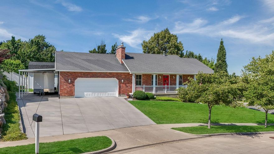 Nestled on the desirable east bench of Bountiful, this charming red brick home is full of character and charm. Enjoy breathtaking views from the comfort of your own deck. The home features five spacious bedrooms and three bathrooms, including a private primary suite with an ensuite bath and walk in closet. The fully finished basement offers additional living space with two bedrooms, bath, family room and separate outside entrance, ideal for guests or multi-generational living. Vaulted ceilings in the front living room, complemented by a wood burning stove, create a warm and inviting atmosphere. The fully fenced and landscaped backyard includes TREX decking, mature landscaping, and large shed for extra storage. A spacious driveway, covered carport and oversized garage provide ample parking options. Don't miss out on this fantastic property!