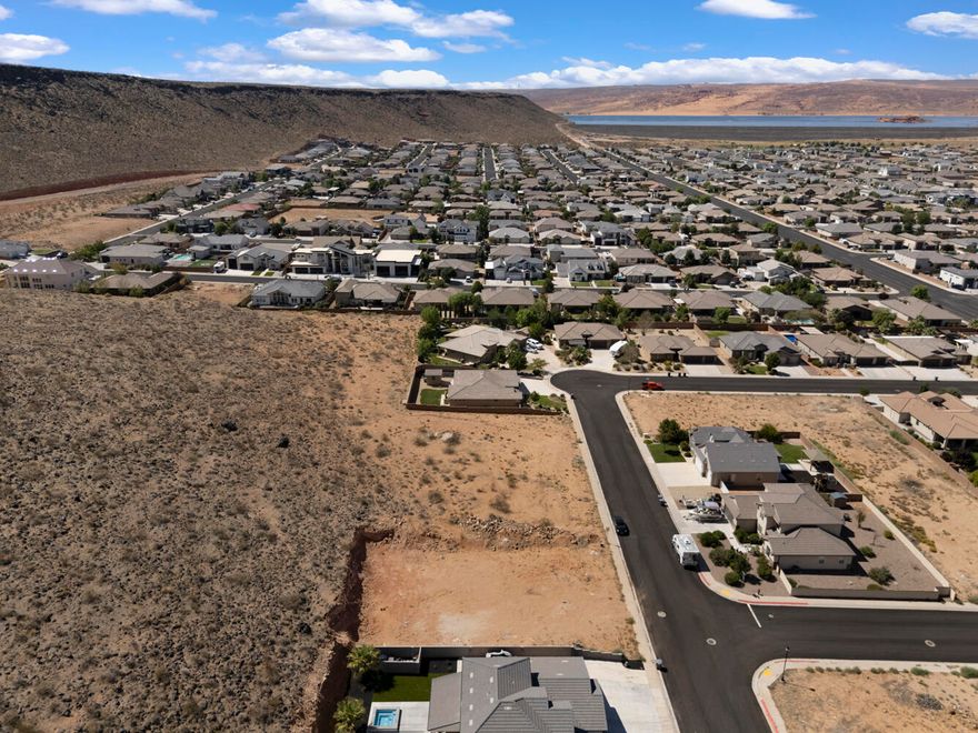 Build your dream home on this spacious .26-acre lot in the highly sought-after Dixie Springs subdivision in Hurricane, Utah. With no HOA and the freedom to bring your own builder, you can design a custom home that fits your lifestyle. Whether that includes an RV garage for all your toys or a peaceful retreat to unwind.

Backing to a natural hillside with no backyard neighbors, this lot offers added privacy and a serene setting. Located just minutes from Sand Hollow Reservoir, Sand Mountain dunes, and Dixie Springs Park, you'll enjoy year-round access to boating, off-roading, hiking, and pickleball. Plus, with direct SXS access from your garage to world-class trails, adventure starts right at your doorstep.

Enjoy its close proximity to Zion National Park, top-rated golf courses, and stunning red rock views.

Utilities are stubbed, water fees are paid, and this lot is ready for you to build, invest, and enjoy everything Southern Utah has to offer. Don't miss this rare opportunity!