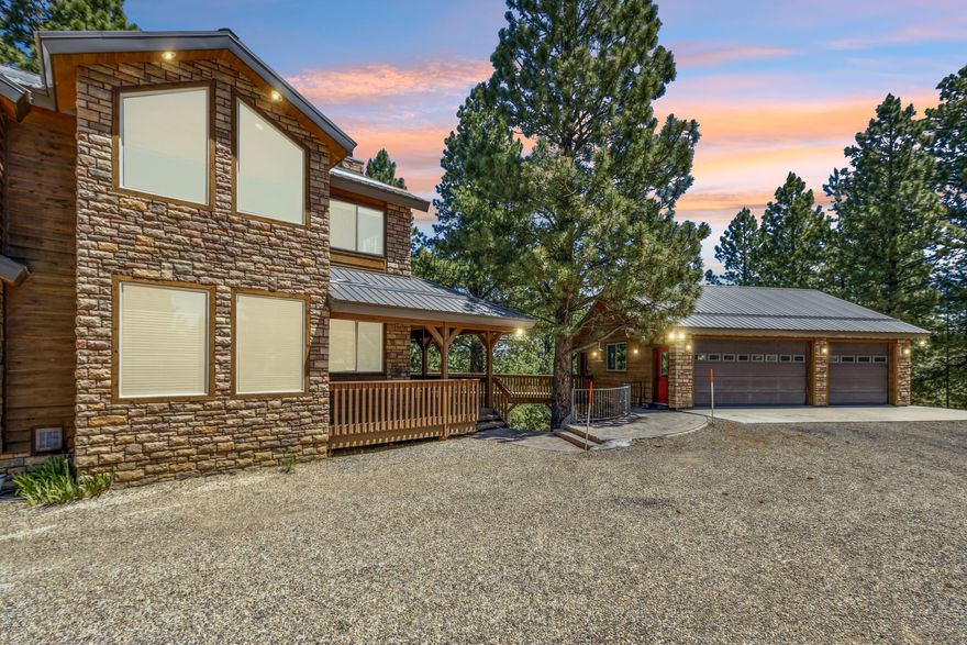 Welcome to your next investment gem — a fully furnished 7-bedroom, 7-bath craftsman-built cabin nestled in the pine forest of Elk Ridge Subdivision. Perfectly positioned between Bryce Canyon National Park and Zion National Park, this property offers year-round access and is only 45 minutes from both parks and Brian Head Ski Resort. Adventure awaits in every direction!
This stunning cabin is designed with versatility and comfort in mind. The main house features 5 spacious bedrooms and bathrooms, while two separately-accessed 1-bed/bath casitas provide private lodging for smaller groups — ideal for maximizing nightly rental income.
Enjoy crisp mountain air from your covered deck with a private hot tub. Or gather around the wood stove in the oversized garage/game room which offers additional entertaining space and storage. With ample parking and situated on a .8-acre wooded lot, guests will have room for privacy and relaxation.
Whether you're seeking a profitable short-term rental or a luxurious basecamp for year-round recreation, this mountain retreat is a fantastic find in an unbeatable location.