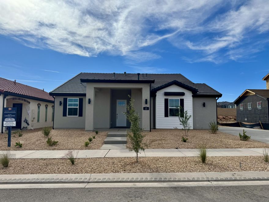 This beautiful new construction home features the Dune DT floor plan, thoughtfully designed and built by CareFree Homes—Southern Utah's trusted builder. Carefree delivers service that exceeds our home buyers expectations before, during and after the sale! Conveniently located near major highways and just minutes from exciting new commercial developments, this home is perfect for both work and leisure. Highlights include durable 2x6 construction, stylish 2'' faux wood blinds, epoxy-coated garage floors, a fully landscaped yard with turf, quartz/granite countertops, and soft close drawers. Nestled within a vibrant and growing community, you'll enjoy a wealth of amenities right at your doorstep, including a state-of-the-art lagoon and all year long heated pool with several pickleball courts, perfect for outdoor fun and relaxation with family, friends and neighbors. Call today for a showing or for more information about Southern Utah's unique community, Desert Color.