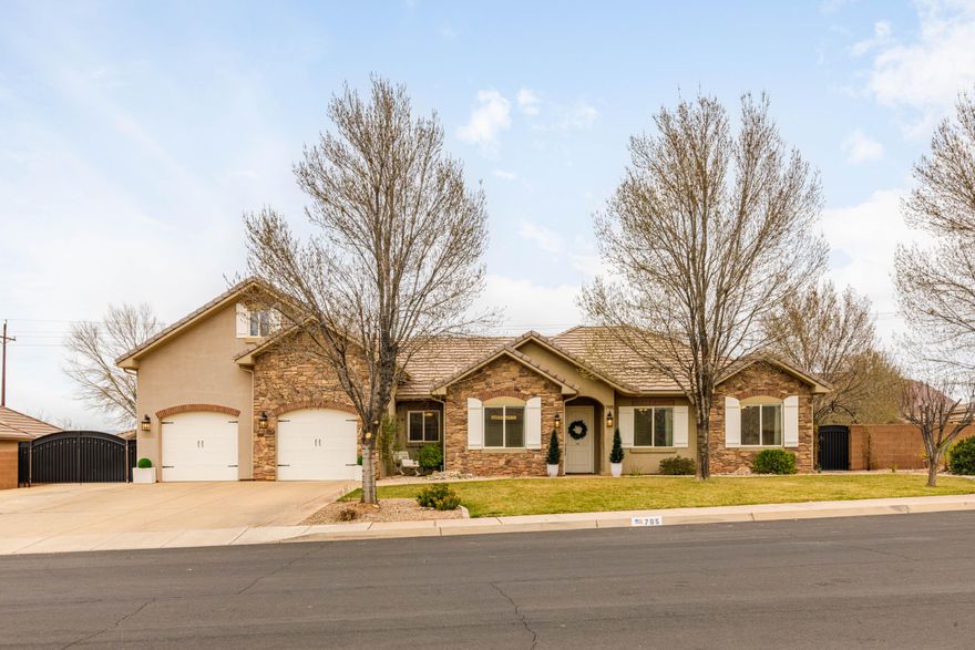 Welcome to 795 E Desert Bloom Court in Washington--a beautifully maintained home nestled in a quiet cul-de-sac in the desirable Washington Fields area. This property offers a bright, open-concept layout with high ceilings, abundant natural light, and quality finishes throughout.

The spacious kitchen is a standout feature, showcasing rich wood cabinetry, granite countertops, stainless steel appliances, and ample workspace--perfect for both everyday living and entertaining. The kitchen flows seamlessly into the main living area, where large windows frame the backyard and fill the space with natural light. A cozy fireplace with custom built-ins creates a warm and inviting focal point.

The main living space features hardwood flooring, elegant trim work, and a thoughtful layout designed for comfort and functionality. The adjacent dining area offers easy access to the backyard, ideal for indoor-outdoor living.

Second level features a bedroom, 3/4 bathroom, and living space- perfect for a lounge, office, or guest retreat.

Schedule your showing today!