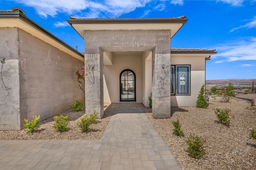 Discover this exquisite, designer-curated, new construction home in The Heights at Washington Bench. 

This stunning two-story residence features an ideal split level layout. The main level great room, gourmet kitchen, open dining, and wall of windows bring in natural light and showcase the surrounding valley views.

The main floor primary suite features a luxurious bathroom and breathtaking views. A second junior suite with ensuite bathroom, and third bedroom/office, and full guest bath round out the main level living space

The attached oversized garage with 2 car plus RV bay provides ample space for storage, a workout area, or housing recreational vehicles.

Step outside the main level and basement level covered outdoor living and entertaining areas for even more enjoyment! The full basement features three additional guest bedrooms, two full bathrooms, an inviting living area, dining nook, and bonus kitchenette, perfect if you need more space or for entertaining guests.

Situated amidst beautiful desert and mountain scenery, this neighborhood offers endless recreation opportunities with numerous nearby hiking trails.

No HOA

Newly finished full landscaping, and block walls.