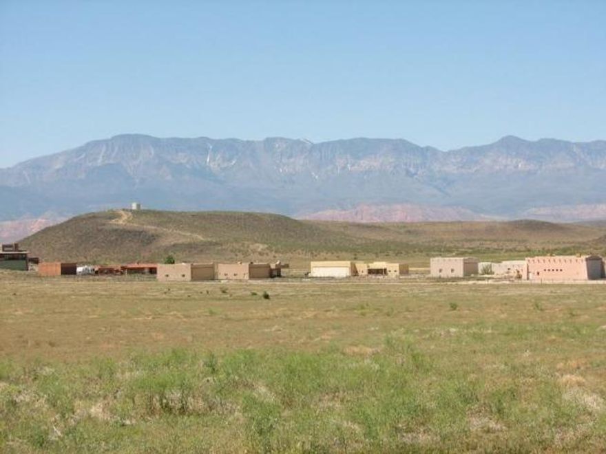 Level 10 acre parcel just South of Sky Ranch. Seller believes utilities in the street to the North of the property, but has no personal knowledge of this. Buyer will need to verify location on utilities. Close to LM, easy access to state park and sand dunes. New proposed development in immediate area. Seller is a licensed RE Broker.
