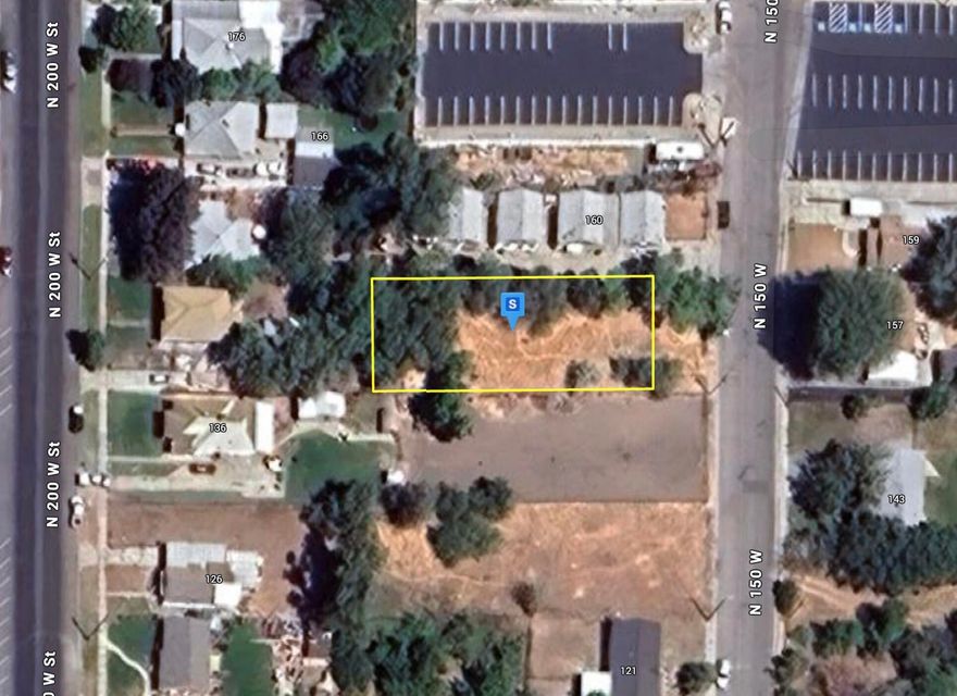 This 0.25-acre lot in Tooele is perfectly situated just three blocks from Main Street, offering easy access to schools, shopping, and dining. Partially wooded and fenced, the property combines privacy with a prime, central location. Please note that water shares are not included and will need to be purchased separately from the city or existing water share owners. An ideal opportunity to build your home in a convenient, well-connected neighborhood.