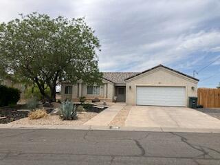 Inviting 3 bedroom, 2 bath home, almost a quarter acre (.22) fenced backyard, great views of the mountains. HVAC new 8/20. Newer kitchen appliances, LVP floors, fruit tree, desert landscaping in shady front yard, covered back patio. approved for nightly rental, steps away from Power Plant Park and trailhead to the Virgin River. The popular River Rock Roasting Co. is nearby. 35 mins. from Zion National Park, Quiet neighborhood.