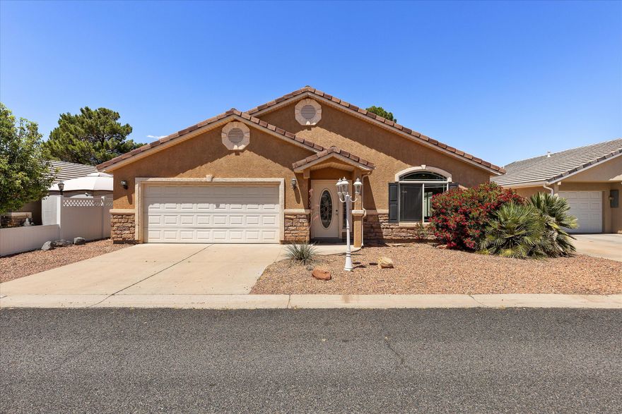 Located in Quail Lake Estates, this 2003 stick-built single-family home offers 1,298 sqft, 3 bed, 2 bath, 2-car garage on a 0.10-acre lot with a private fully fenced backyard perfect for kids & pets. Features include new LVP flooring, new interior paint, Corian countertops, tile roof, stucco/rock exterior, easy-maintenance landscaping, pergola-covered patio, and included fridge plus washer/dryer. HOA is $91/month and includes clubhouse, heated pool, playground, pavilion, sewer, water, garbage, common area maintenance, and private roads. Near Sand Hollow, Quail Creek, Zion National Park, golf, hiking, biking, boating, fishing, shopping, and only 15 minutes to St. George.