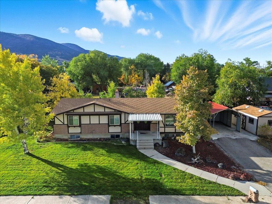 The seller is now offering a $5,000 credit that may be applied toward closing costs or home repairs, giving you added flexibility and value in your home purchase. Whether you're looking to reduce upfront expenses or make a few updates to truly make the home your own, this incentive can make a meaningful difference. Welcome home to this spacious and cozy home located in the heart of beautiful Manti, Utah! This spacious 5-bedroom, 3-bath home offers comfort, functionality, and small-town charm on a fully landscaped .32 acre lot. Inside, you'll find two large family rooms, two laundry areas, and a semi-formal dining room -perfect for gathering and entertaining. The inviting layout provides plenty of space for everyday living with room to grow. The basement features a cozy dry bar, walkout basement, gas fireplace, a large food storage room, and additional space that's ideal for a home gym, craft area, or playroom. Step outside to enjoy the fully landscaped yard with mature trees, lush grass, and open space for kids and pets to play. The extra-large deck is the perfect place to enjoy evening dining or take in the stunning mountain views. A convenient carport provides off-street parking, and the property includes a storage shed with power for tools or outdoor gear. Located close to schools, parks, and downtown amenities, this home combines practicality, comfort, and a peaceful setting. Come see why this charming property is the perfect place to call home in Manti! Square footage figures are provided as a courtesy estimate only and were obtained from the Sanpete County Recorder's office. Buyer is advised to obtain an independent measurement.