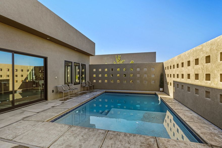 Located in a prestigious luxury neighborhood, this exceptional 4-bedroom, 4.5-bath residence offers 3,035 square feet of thoughtfully designed living space that seamlessly blends sophistication with resort-style comfort. Designed with hosting in mind, one bedroom features a custom bunk room complete with space for two full sets of bunk beds, its own private living area, and an en-suite bathroom--perfectly suited to accommodate multiple guests or extended family with ease and privacy. The backyard is a true private oasis, showcasing a stunning pool ideal for relaxing or entertaining under the sun. Ideally situated just minutes from Sand Hollow Resort and less than an hour from Zion National Park, this home offers unparalleled access to world-class recreation. Live where others vacation!