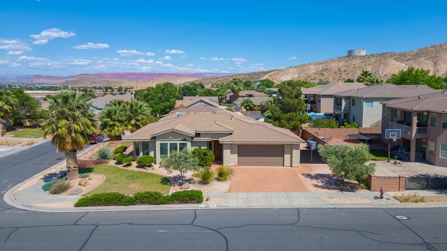 This beautifully cared-for corner-lot home offers the perfect blend of comfort, convenience, and scenic beauty in a highly desirable no-HOA neighborhood. Take in stunning, unobstructed west-facing mountain views from the front porch, with easy walkway access to Hidden Valley Park located just across the street.

Designed with both functionality and lifestyle in mind, the property includes newly expanded RV parking with a large concrete pad along the side of the home, plus an oversized extra-wide garage with an impressive 24-foot depth. The backyard is a private, low-maintenance retreat featuring a covered patio, mature shade trees, and stylish paver accents--ideal for relaxing or entertaining year-round.

Inside, the bright open floor plan is filled with natural light from expansive windows that showcase the surrounding mountain views. Affordable Dixie Power helps keep utility costs low, adding even more value to this exceptional home. Recent exterior updates, including freshly painted stucco and garage door, complete the home's clean and inviting curb appeal. 
Buyer and Buyers agent to verify all information.