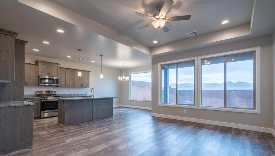 PET FRIENDLY - Enjoy the stunning views from inside the house or on your back patio.  This peaceful retreat is perfect for watching the sun rise or set over the mountains. Built with extra space in the walls to ensure peace and quiet from your neighbors. This single level, 3 bedroom/ 2 bath home is complete with custom blinds, fridge, stove, dishwasher, washer/dryer and features granite countertops, coffered ceilings, 8-foot interior doors and easy to clean expoxy garage floors. See floor plan in photos. This home is ready to move in. Pets & short term leases are also considered. Call to schedule your showing today!