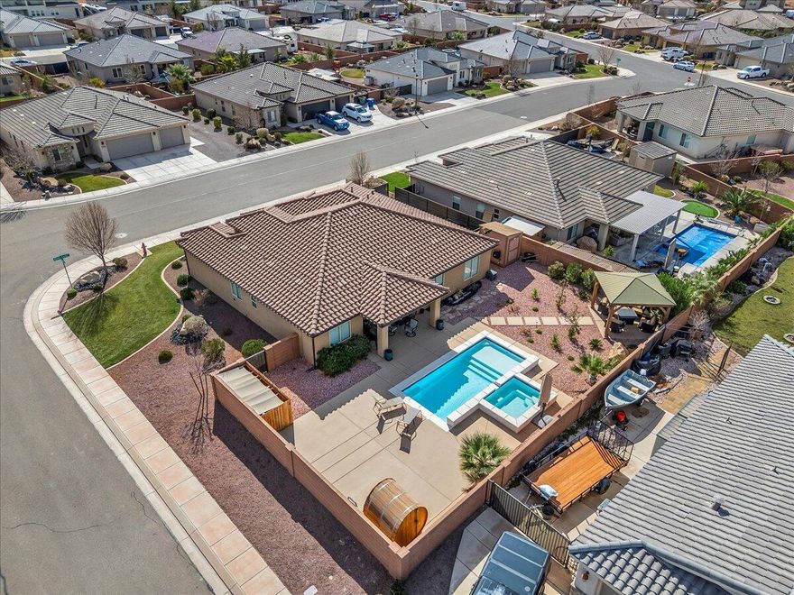 Welcome to your private desert oasis in the highly desirable Sugar Plum community. This beautifully designed home features vaulted ceilings and an open concept living room and kitchen filled with natural light. The resort style backyard is a true retreat with pool, hot tub, sauna and pergola surrounded by easy maintenance desert landscaping. Enjoy a 3 car garage with mini split system and epoxy flooring. With seamless indoor/outdoor living and exceptional upgrades throughout, this home offers the ultimate desert lifestyle.