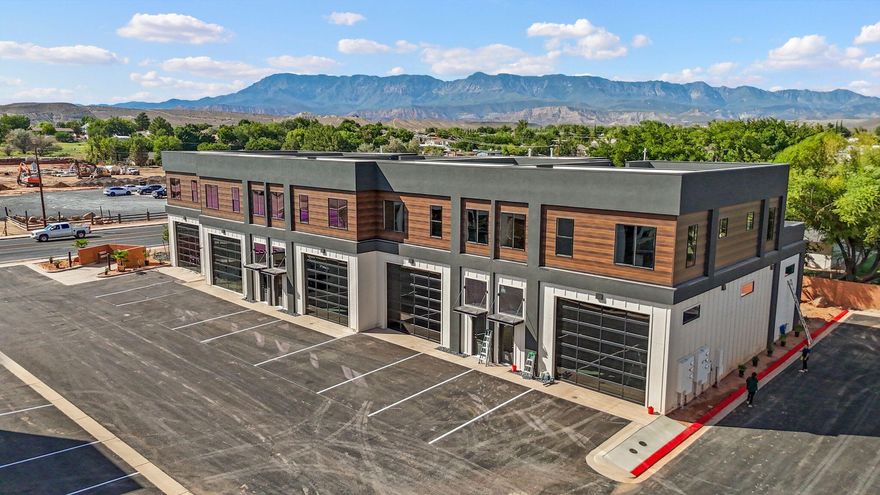 Nestled in the scenic beauty of La Verkin, UT, these versatile flex spaces offer a unique investment opportunity in one of southern Utah's fastest growing areas.  Strategically located near Zion National Park & bustling with potential, these modern, customizable spaces are perfect for entrepreneurs, creatives & businesses seeking a dynamic environment to thrive.  With a blend of small-town charm & proximity to major hubs, these properties are ideal for those looking to secure a foothold in an up-and-coming community. Units are offered as a 'gray' shell with 1800 sf of garage space (14x16 garage door & 62 ft deep), 1600-1800 sf on the 2nd level for office space, storage, etc., 300 sf of mezzanine & 800 sf of structurally supported rooftop patio.  HOA $125/mo & includes a putting green