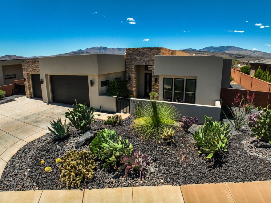 Exceptional home in a highly sought-after newer community in Ivins, surrounded by breathtaking red rock and desert views. Thoughtfully designed, this home features striking fireplaces in both the great room and private casita, creating warm and inviting living spaces. The open-concept kitchen flows seamlessly into the spacious dining and living areas, perfect for entertaining or everyday comfort and easy access to the backyard patio w/automatic climate shades and complete with a firepit and tranquil water feature. Enjoy close proximity to scenic hiking and biking trails, Tuacahn, Kayenta, and Snow Canyon State Park. Beautiful finishes, multiple additional built in cabinets, quality craftsmanship, and an unbeatable location make this home a rare opportunity.