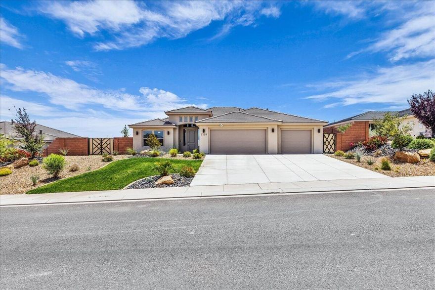 Modern desert living meets comfort and style in this beautifully designed home featuring an open-concept layout, soaring ceilings, and expansive living spaces filled with natural light. The stunning kitchen is the centerpiece of the home with a massive quartz island, sleek dark cabinetry, designer lighting, walk-in pantry, and seamless flow into the spacious great room--perfect for entertaining or everyday living. Additional upgrades include electric blinds in living room and primary bedroom, samsung appliances, upgraded cabinetry throughout, upgraded LVP flooring.  Step outside to a large covered patio and fully fenced backyard with plenty of room to create your dream outdoor retreat while enjoying peaceful desert surroundings and mountain views. Complete with a 3-car garage, beautiful curb appeal, and located in a desirable neighborhood, this home combines modern elegance with functional living
