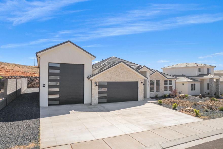 ~ OVERSIZED 52' DEEP RV GARAGE~
Full landscaping included

This stunning home in the sought-after Sand Hollow Village area blends modern comfort with the ultimate recreational lifestyle. 

- Ask about adding a pool-

One of the home's standout features is the massive 52-FOOT DEEP RV GARAGE (12' wide x 14' tall door)! Inside, you'll find an open-concept layout with LUXURY FINISHES, spacious bedrooms, and LARGE BACKYARD WITH ROOM TO ADD A POOL! 

This property comes equipped with premium SMART HOME features including 3 wired in insecurity cameras and a door bell camera. Just minutes from Sand Hollow Reservoir, Sand Hollow Golf Course, the sand dunes, and Zion National Park, you're surrounded by year-round adventure - boating, biking, hiking, off-roading, and more. 

Contact listing agent for PRIVATE SHOWINGS & ADDITIONAL INCENTIVES!