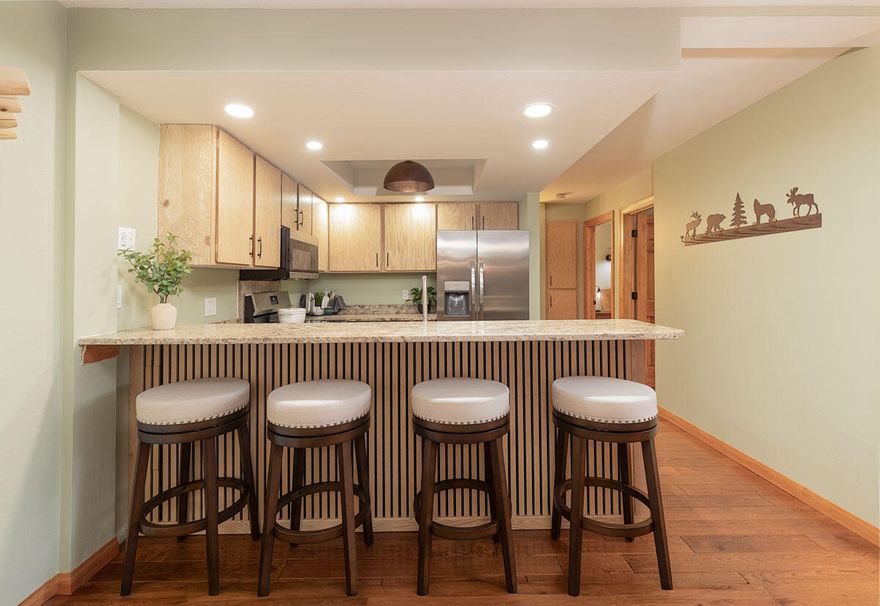 Nestled in the heart of Brian head, Utah, this stunning ski-in/ski-out condo is a winter wonderland dream come true.  Recently renovated to perfection, this darling retreat boasts brand-new granite kitchen counter tops, brand new stainless steel appliances, stainless steel sink, refinished cabinetry, and even... a wine fridge!
Both bathrooms have newly refinished cabinetry as well as fresh new quartz countertops. The space is bathed in natural light, thanks to the newly installed lighting. Enjoy new primary bedroom furnishings as well as new furnishings in the living room that are equal parts cozy and chic.  With the slopes literally at your doorstep, you can hit the trails in the morning and cozy up by the fireplace in the evening. This is a first floor condo. This building offers a private hot tub. Amenities also include a game room, laundry room, sauna, and parking underneath. Don't miss out! This home has it all!  Vacation Rental Approved.  Sold Furnished