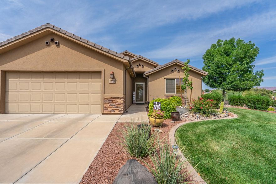 This beautifully maintained property located on a corner lot in the Terraces at Seven Hills Subdivision, offers spectacular views of Red Mountain and Snow Canyon State Park. The open concept living area includes a living area that flows into the dining and kitchen areas featuring vaulted ceilings, granite countertops, knotty alder cabinetry and storage. The home offers a covered patio that is an entertainer's dream with a low maintenance backyard that may be entered from the dining area or master suite for entertaining and relaxation.