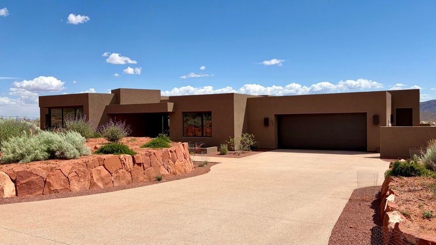 Experience elevated desert living in this brand-new custon home in the sought-after community of Kayenta. Perfectly positioned to capture breathtaking red mountain views, this thoughtfully designed residence offers 3 bedrooms plus a dedicated office/den and 3.5 bathrooms with a seamless blend of luxury and comfort.

Enjoy an open-concept floor plan filled with natural light, high-end finishes, and indoor-outdoor living ideal for the Southern Utah lifestyle. The oversized 3-car garage provides ample space for vehicles, storage, and recreational gear. Conveniently located the renowned Kayenta Art Village, you'll enjoy easy access to art galleries, dining, performances and scenic desert trails.

Move-in ready and designed for effortless living - this is your opportunity to own a stunning new construction home in one of Southern Utah's most distinctive communities.