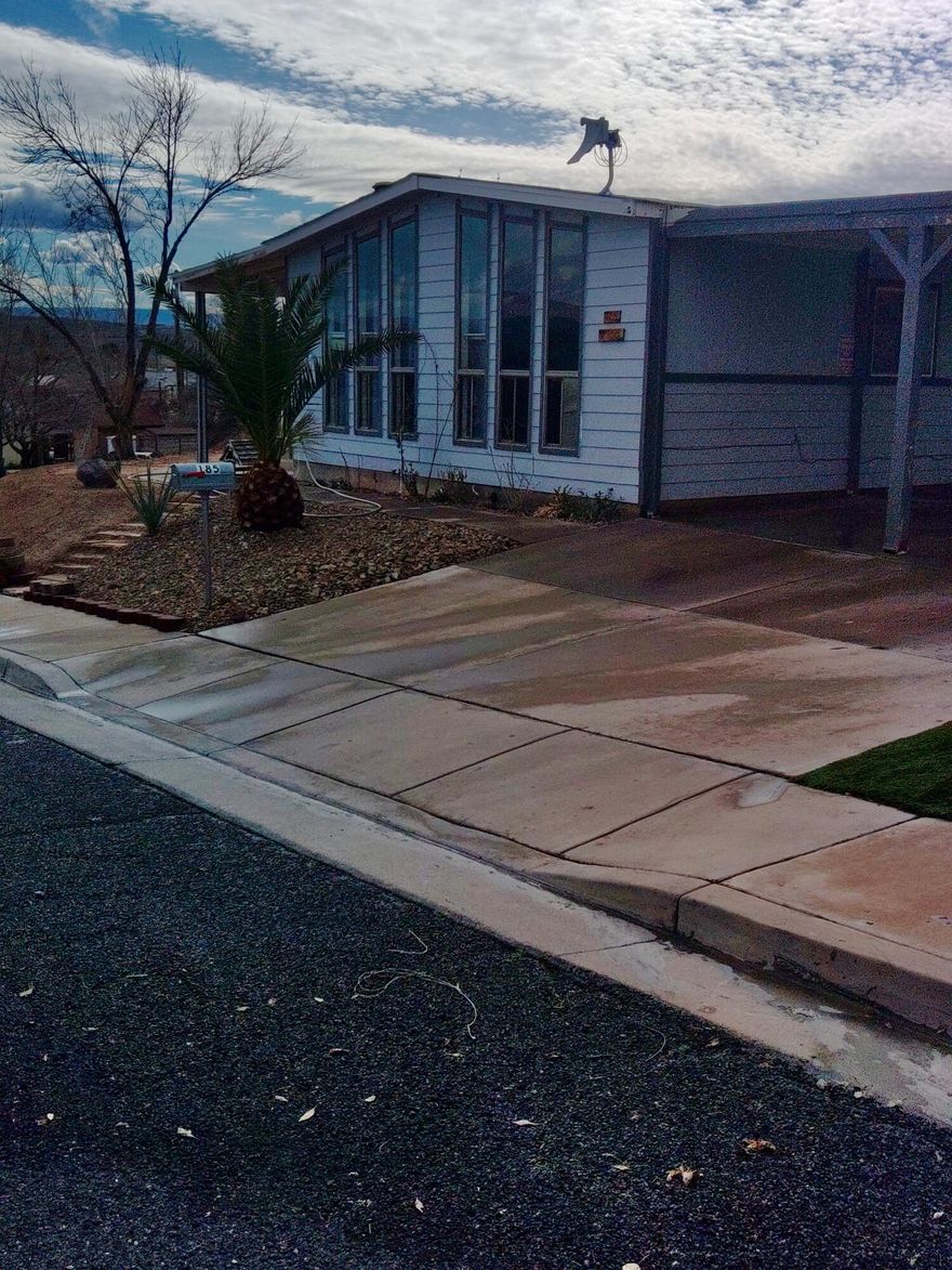 Enjoy breathtaking views of the St. George Temple and stunning Southern Utah red mountains from this beautifully maintained 3-bedroom, 2-bath home situated on a desirable corner lot.

This property offers the perfect blend of comfort, functionality, and lifestyle. The newly renovated kitchen features modern finishes, updated cabinetry, and ample counter space--ideal for everyday living and entertaining.

Step outside and you'll find a backyard designed to enjoy Utah's natural beauty. Relax under the charming gazebo while taking in the mountain views, cultivate your own produce in the dedicated garden area, or enjoy year-round comfort in the detached shop complete with A/C and power--perfect for projects, hobbies, or additional workspace.

The home also includes RV parking and a powered workshop, offering exceptional flexibility for outdoor enthusiasts and hobbyists alike.

With its rare temple views, red rock backdrop, corner lot location, and upgraded features throughout, this home truly captures the best of St. George living.