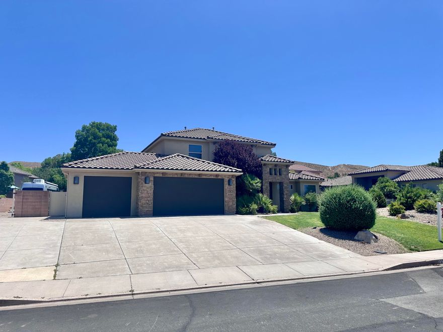 Stunning 5-bed, 3-bath home with 2,627 sq ft on a .31-acre lot. Features a front office/den perfect for remote work or study. The spacious master suite offers a double-sink vanity, soaking tub, walk-in shower, and walk-in closet. Enjoy a large backyard ideal for entertaining, plus RV parking and a 3-car garage. Located in a sought-after neighborhood with a well-maintained HOA offering a sand volleyball court, basketball court, and high-speed fiber internet. Zoned for Crimson Cliffs schools and walking distance to Horizon Elementary. Friendly community, large front yard, and ample guest parking make this home the full package—space, comfort, and great amenities!