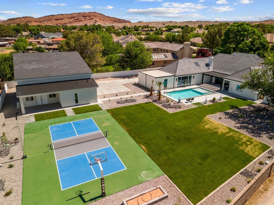 Welcome to this stunning custom Santa Barbara Style Estate with spanish flares nestled on a sprawling 1-acre lot in the Bloomington Ranchos, offering the perfect blend of traditional charm and contemporary luxury.As you approach the property, you'll be captivated by the elegant arched doorways, windows and a vibrant white exterior with black accents and roof tiles that evoke the essence of modern architecture. Step inside to discover an open-concept layout adorned with high ceilings, a bridge walkway with iron railing, natural walnut trim and large windows that flood the space with natural light. The split floor plan design provides 3 separate wings of the estate, so plenty of space for everyone. The gourmet kitchen boasts state-of-the-art appliances, custom walnut cabinetry, and a spacious island perfect for entertaining. The adjoining living area features a cozy fireplace and seamlessly connects to outdoor living spaces with a retractable iron and glass door creating the ideal setting for enjoying warm evenings under the stars. The 2nd level has a private on-suite and double loft area that serves as another gathering space.
Retreat to the luxurious master suite, complete with a spa-like ensuite bathroom featuring a soaking tub, walk-in shower, and massive closet with private laundry area. The 2nd Owner Suite comes loaded with its own private entrance, laundry room and possible kitchen if desired to accommodate guests in their own Casita. The additional bedrooms are generously sized, each with unique design elements that reflect the home's character.
Outside, the expansive backyard is a private oasis, a sparkling pool, sport court, RV Garage/shop with full bathroom (plumbed for kitchen and guest house), garden area, fruit trees and ample space for outdoor gatherings. The RV Garage matches home in style & color with a concrete driveway. The RV Garage is 2x6 construction and will be fully insulated with climate controls. This modern Spanish Hacienda is not just a home; it's a lifestyle. Experience the perfect blend of elegance and comfort in a serene setting that offers endless possibilities for entertainment and relaxation. Don't miss the opportunity to call this exceptional property your own!