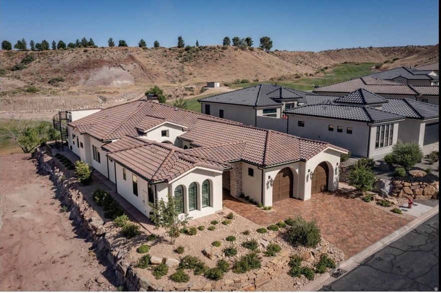 This home is a celebration of beauty and elegance,   Easy golf course living.  Months of designing and building the dream home with Mediterranean Revival syle with state of art modern features.  Perfectly facing east, 4 bed, 4.5 bath,3512 SQ.Ft home features 2X6 construction, Arto pavers and tiles, over sized 2 car garage, impressive doors, 2 EV outlets for EV CARS, 5 HVAC Zones, infrared sauna.   Roof top deck to watch beautiful Southern Utah sunsets.  gourmet kitchen which boasts Wolf/Subzero appliances, including steam oven, quartzite countertops, walnut cabinets and spacious pantry.  Full list of house features is in document section together with a seller's story.The moment you step inside, you realize this home delivers far more than what the camera captures. Once inside, you'll be awed by high ceilings, thoughtful lighting, and beautiful workmanship. Every carefully considered finish reflects a level of craftsmanship that simply has to be experienced in person.