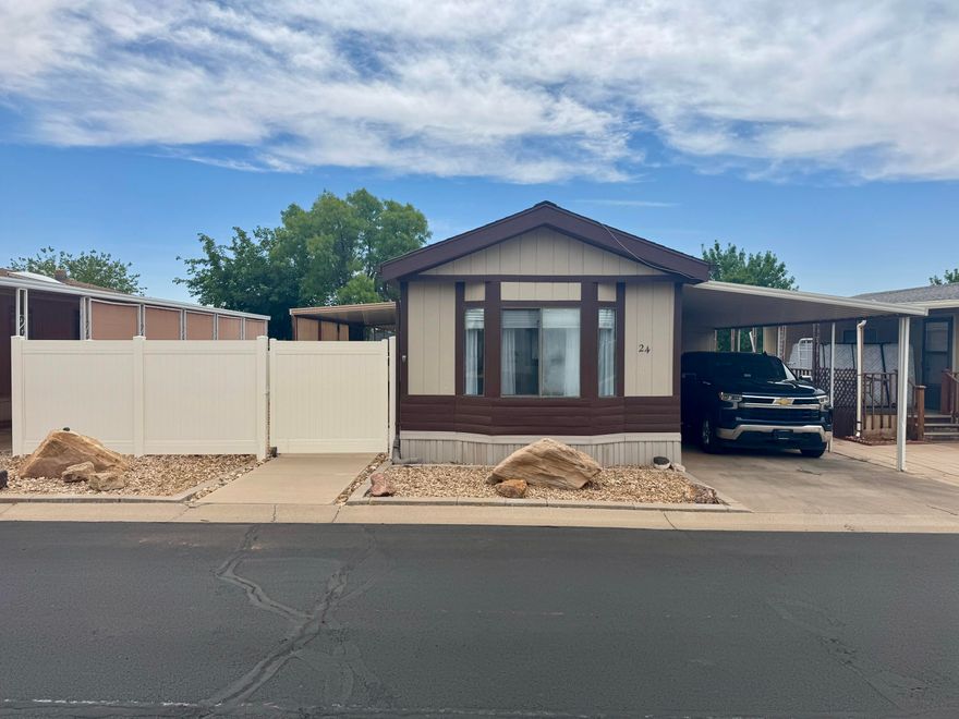 This immaculate 2-bedroom, 2-bath manufactured home is a rare find! The fully enclosed yard with vinyl fencing offers exceptional privacy, while the new shed provides generous storage space—perfect for electric bikes, golf clubs, or even a cabinet shop. Enjoy outdoor living on the covered deck, ideal for relaxing or entertaining. Inside, the beautifully remodeled kitchen features stunning cabinetry, upgraded countertops, and gorgeous flooring throughout. The spacious bonus family room is the perfect place to unwind with a good book or movie. This is truly a must-see home! 
Paradise Palms is a cooperative where owners share in the land loan, scheduled to be paid off in early 2027. HOA covers water and cable. Buyer must be approved by the community. Buyer to verify all information.