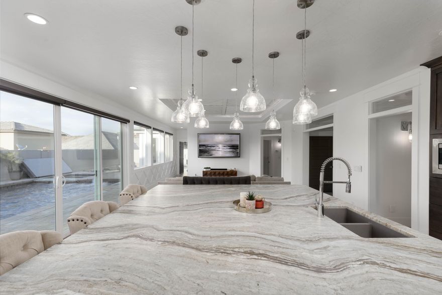 Discover your own private vacation retreat--designed for effortless relaxation and unforgettable gatherings. The saltwater sport pool with spa, swim-up bar, two fire pits, and expansive paver deck creates a resort-style oasis right at home. Inside, this modern getaway offers 5 bedrooms (each with private exterior access), 4 baths, and a bright contemporary kitchen perfect for hosting. The expansive garage easily accommodates 4+ vehicles, boats or UTVs. Also full-length of property for RV parking. Flexible layout offers optional rental potential* for those looking to offset ownership costs. Furniture package negotiable.
All information & square footage figures provided as a courtesy from appraisal, tax records, and plans. Buyer to verify all data. *Restrictions may apply to short-term rental