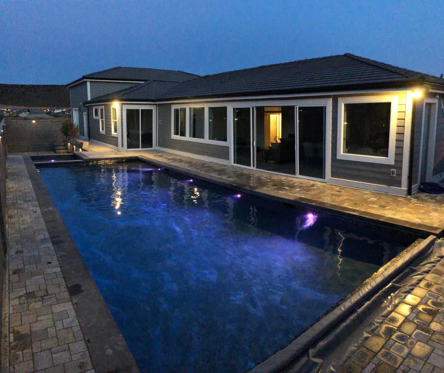 Discover your own private vacation retreat--designed for effortless relaxation and unforgettable gatherings. The saltwater sport pool with spa, swim-up bar, two fire pits, and expansive paver deck creates a resort-style oasis right at home. Inside, this modern getaway offers 5 bedrooms (each with private exterior access), 4 baths, and a bright contemporary kitchen perfect for hosting. The expansive garage easily accommodates 4+ vehicles, boats or UTVs. Also full-length of property for RV parking. Flexible layout offers optional rental potential* for those looking to offset ownership costs. Furniture package negotiable.
All information & square footage figures provided as a courtesy from appraisal, tax records, and plans. Buyer to verify all data. *Restrictions may apply to short-term rental