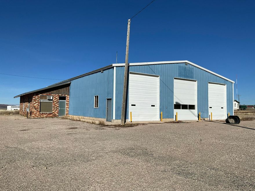 This versatile commercial lease offers an exceptional setup for automotive, mechanical, or industrial use at $5,300 per month plus $110 CAM fees that include water. The 4,800 sq ft shop features two pull-through bays, five roll-up shop doors, and an in-ground mechanic pit for efficient operations. The property includes a bathroom and a 560 sq ft dedicated office space. Outside, enjoy approximately 1.5 acres of yard space, ideal for storage, parking, or equipment, providing flexibility for growing businesses.